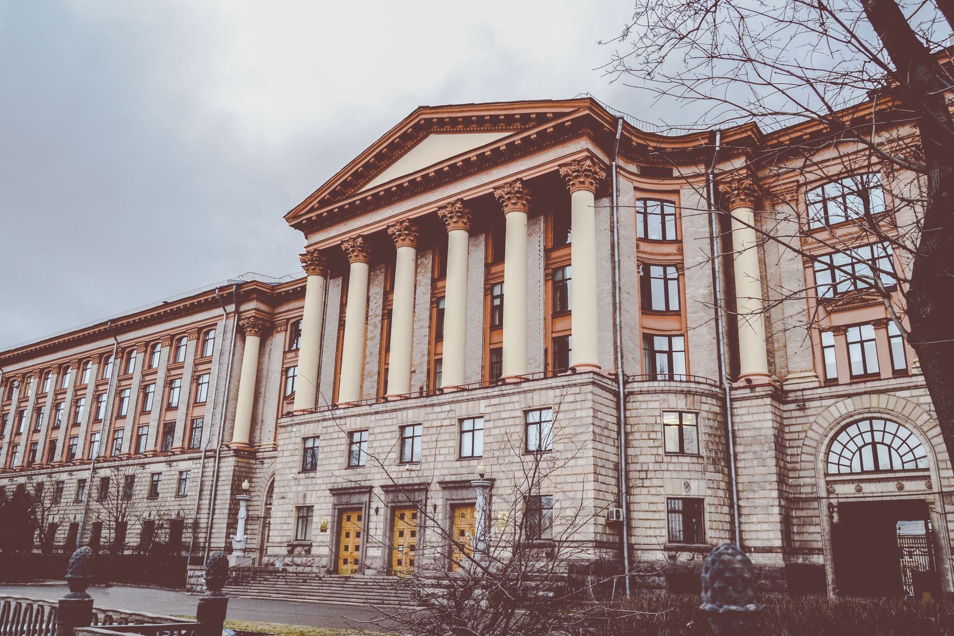 Neoclassical building with tall columns, showcasing architectural elegance.