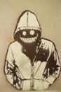 Graffiti of city monster with luminous eyes on city wall