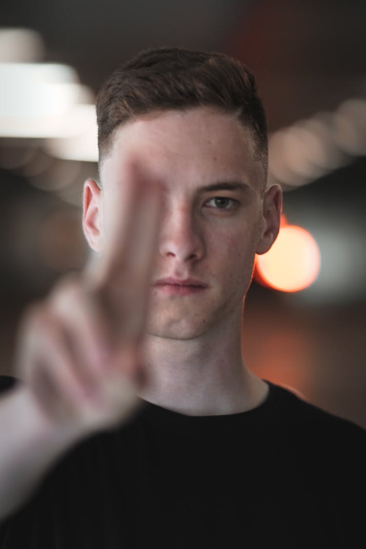 Man Showing Prana Mudra With Fingers On Blurred Background