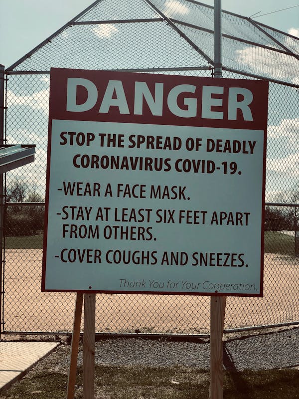 Warning signboard with restrictions during COVID 19 pandemic