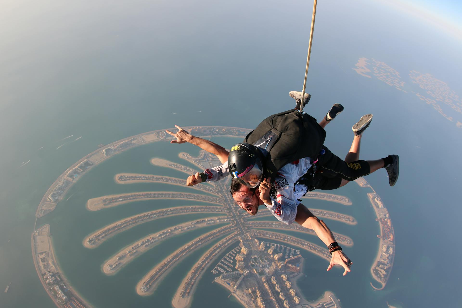 Thrilling skydiving experience above the iconic Palm Jumeirah in Dubai. Perfect adventure spot.