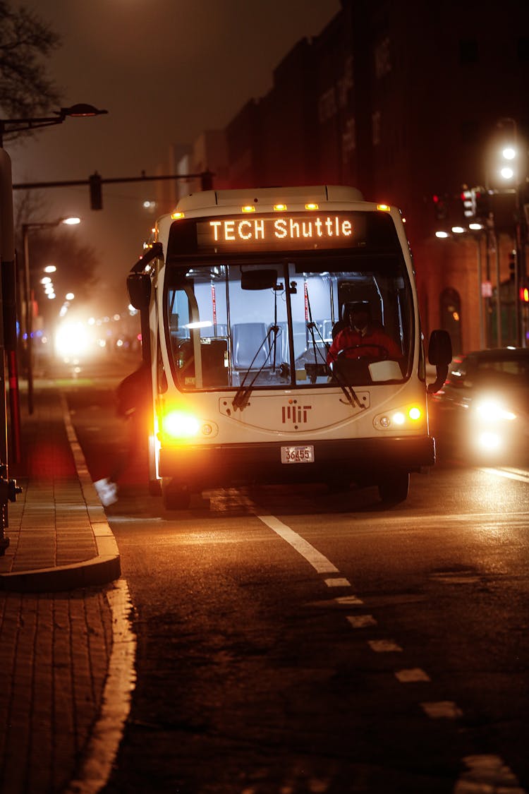Bus Shuttle On The Road At Night