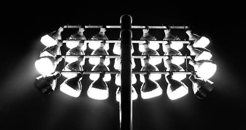 Grayscale Photo of Floodlights