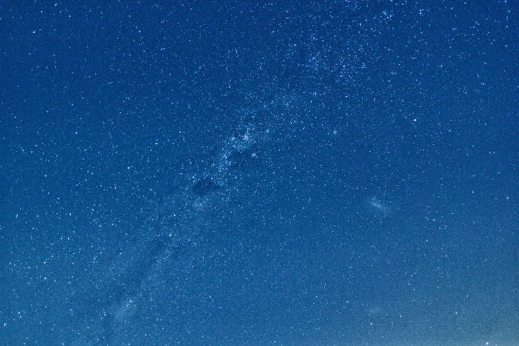 Abstract Background Of Night Blue Sky With Shiny Stars