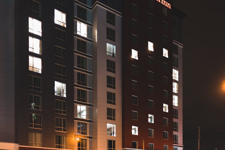 Modern Building With Glowing Light Creating Heart Symbol At Night