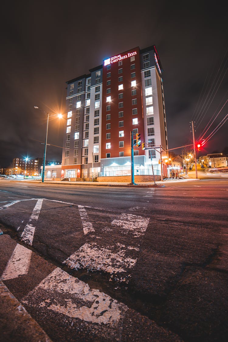 Multistory Building With Shining Windows Creating Heart Symbol In Dusk