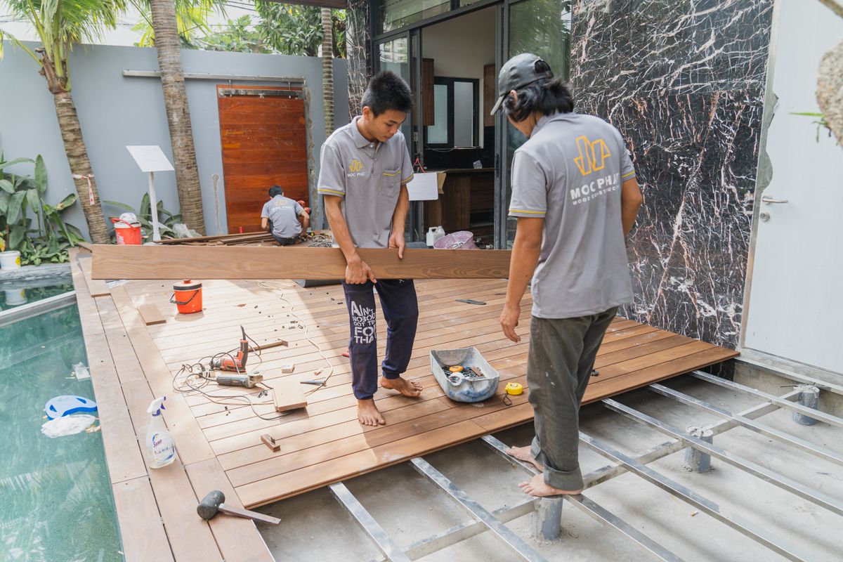 Stock photo of carpenters installing a residential wood floor