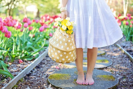 Woman Holding Brown Basket With Yellow Flowers with the Quote "Trying to sneak a fastball past Hank Aaron is like trying to sneak the sunrise past a rooster." written on it and have average color value #A7AC9D