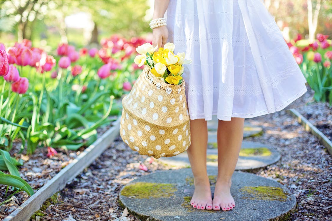 Free Woman Holding Brown Basket With Yellow Flowers Stock Photo