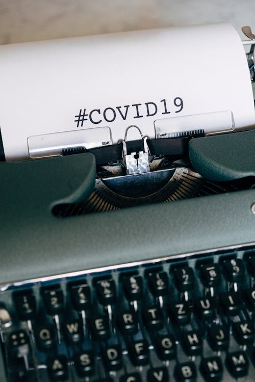Free Covid19 Written Using a Typewriter Stock Photo