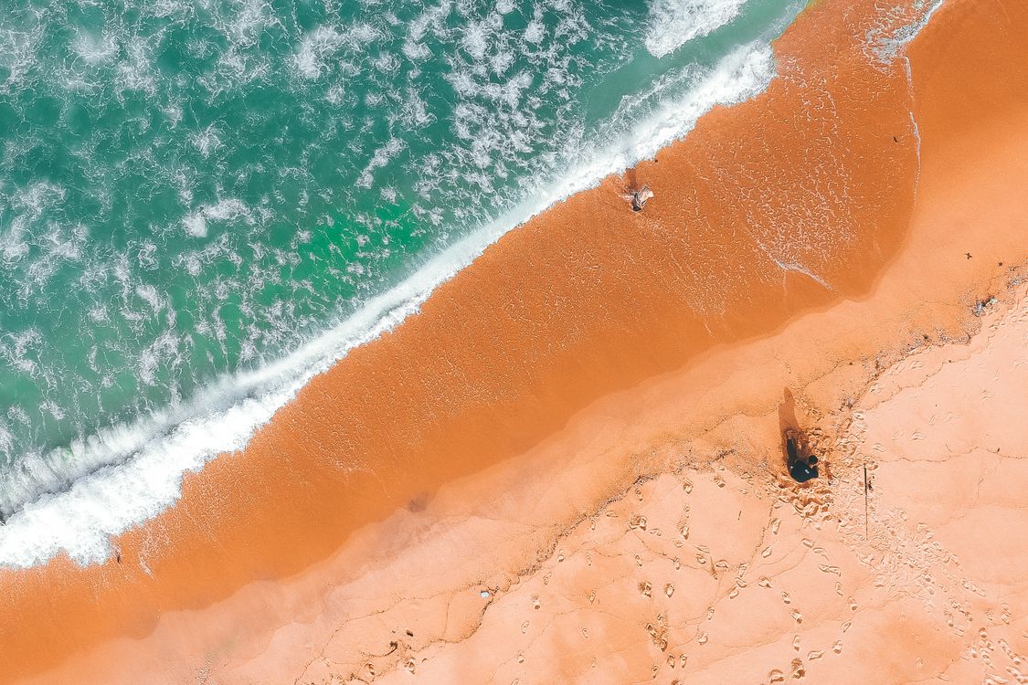 Aerial View Of Person On Beach Free Stock Photo aerial-view-of-person-on-beach-free-stock-photo