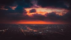 Aerial Shot of a City Under a Cinematic Sky