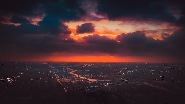 A stunning aerial view of Shanghai cityscape beneath a vibrant sunset sky.
