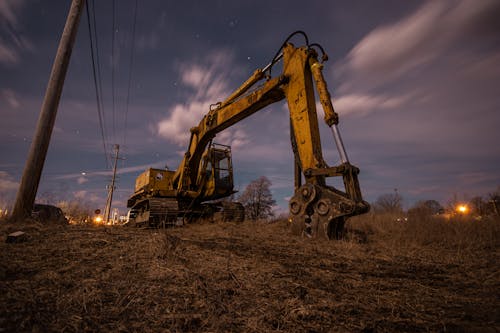 Excavator on Field at Down