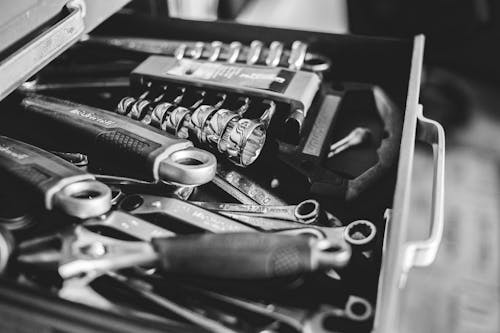 Free From above black and white cabinet drawer with assorted repair tools in craftsmanship Stock Photo