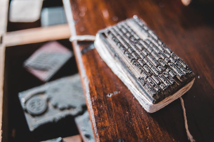 Metal Letterpress On Printing Plate On Desk