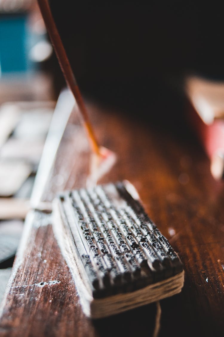 Printing Plate With Letterpress On Wooden Desk