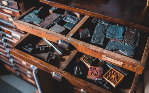 Vintage wooden letterpress type drawers in a printing house