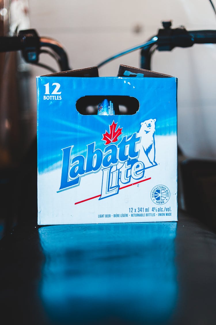 Carton Box With Glass Bottles On Table