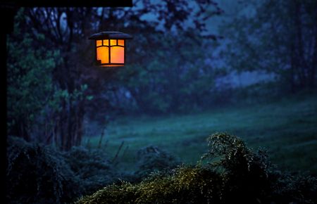 Light glowing at a campsite at night