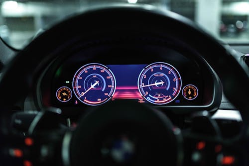 Close-Up Photo of Illuminated Speedometer