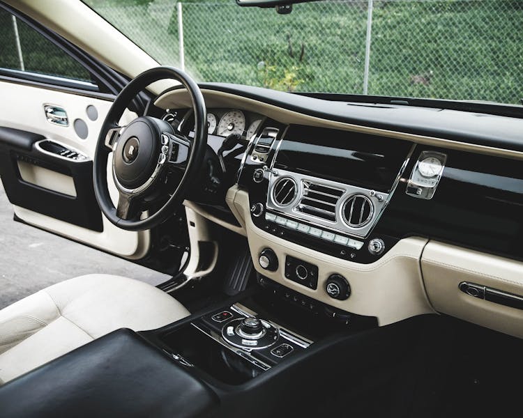 Expensive Luxury Car Interior With White Leather Seats And Shiny Dashboard