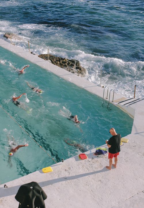 Free Aerial view of swimmers training in a pool by the ocean at Bondi Beach, Australia. Stock Photo