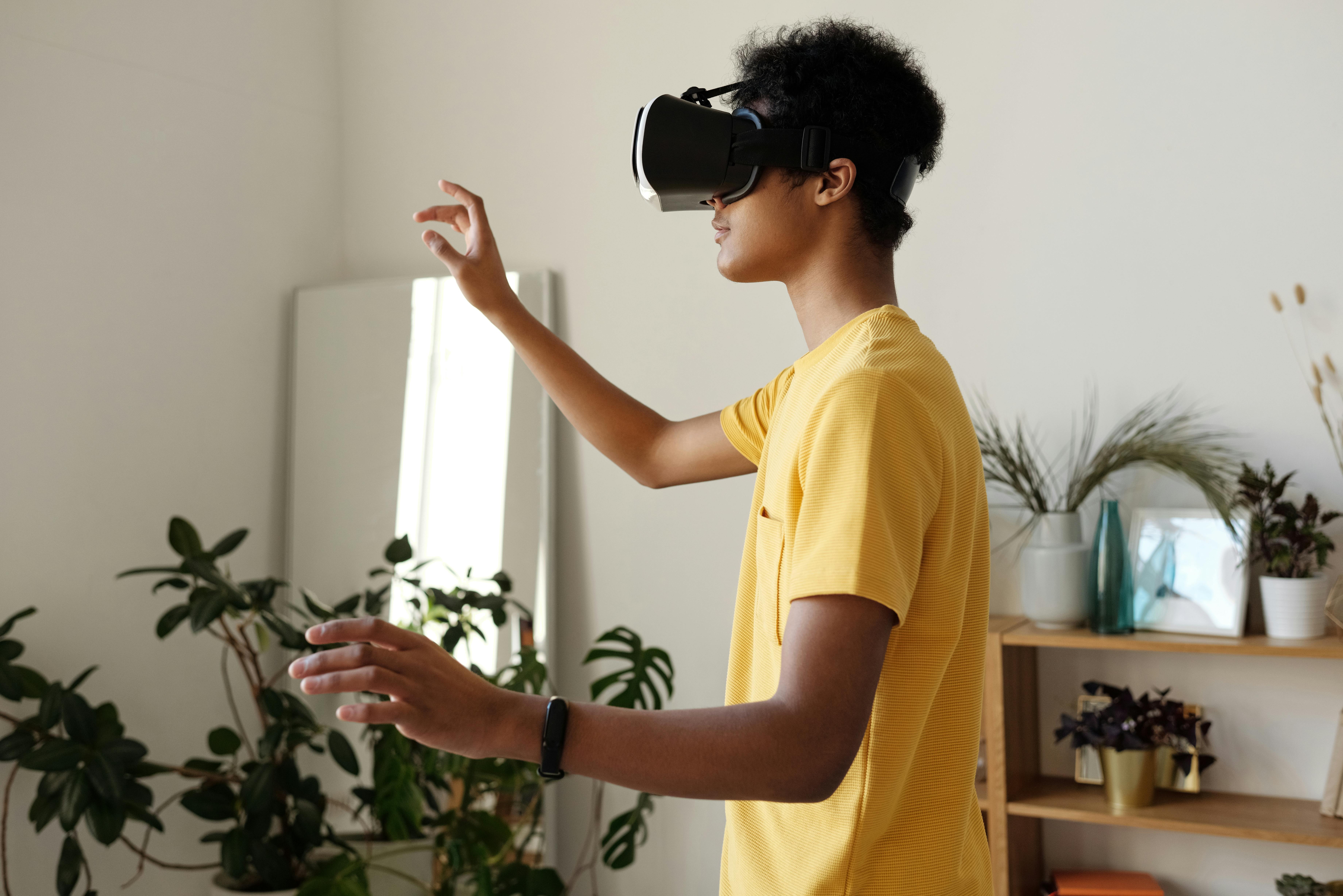 boy in yellow t shirt wearing vr headset