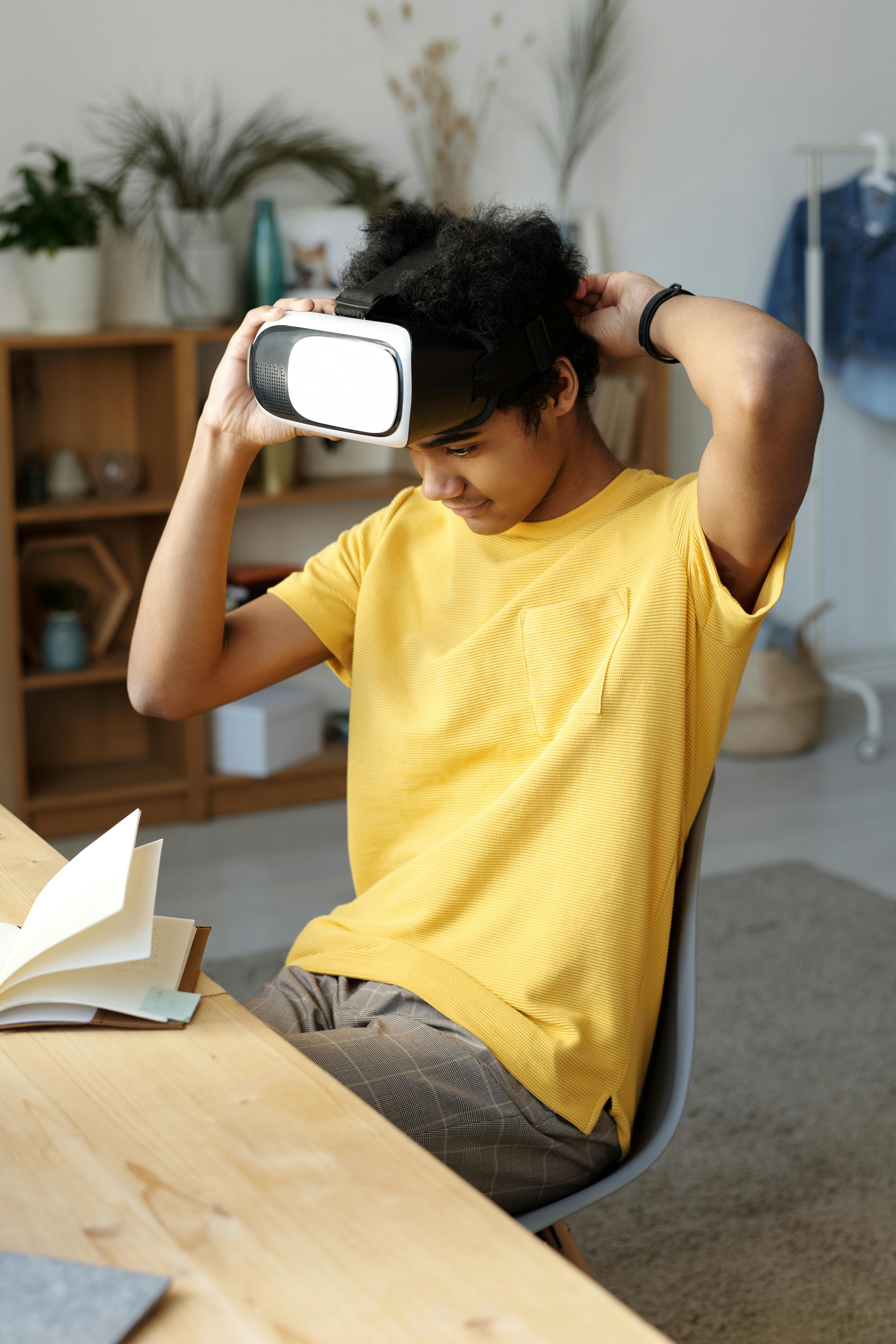 man in yellow crew neck t shirt while wearing vr headset