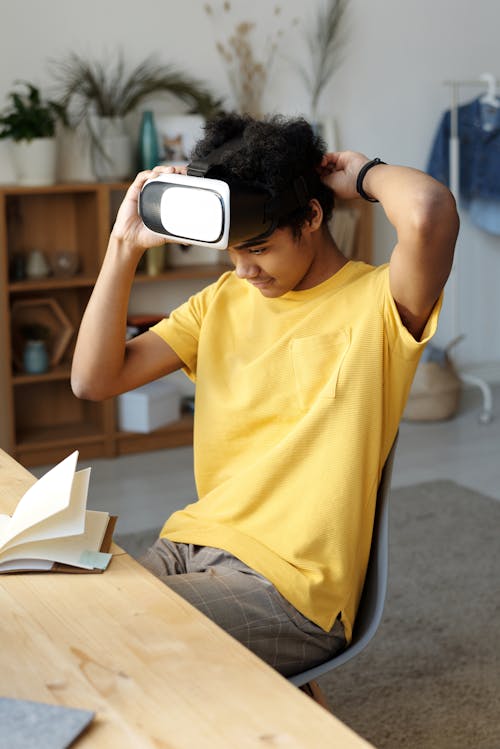 Man in Yellow Crew Neck T-shirt While Wearing Vr Headset