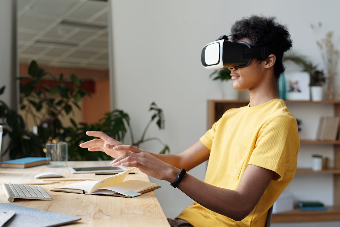 Free Man In Yellow Crew Neck T-Shirt Using Vr Headset Stock Photo