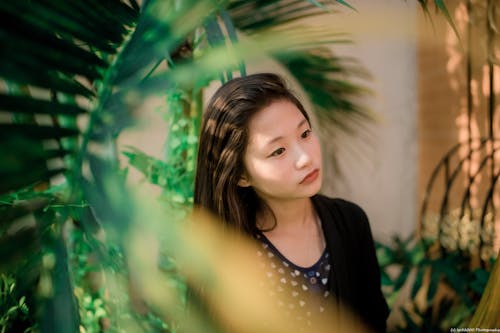 Portrait of Woman Between Leaves