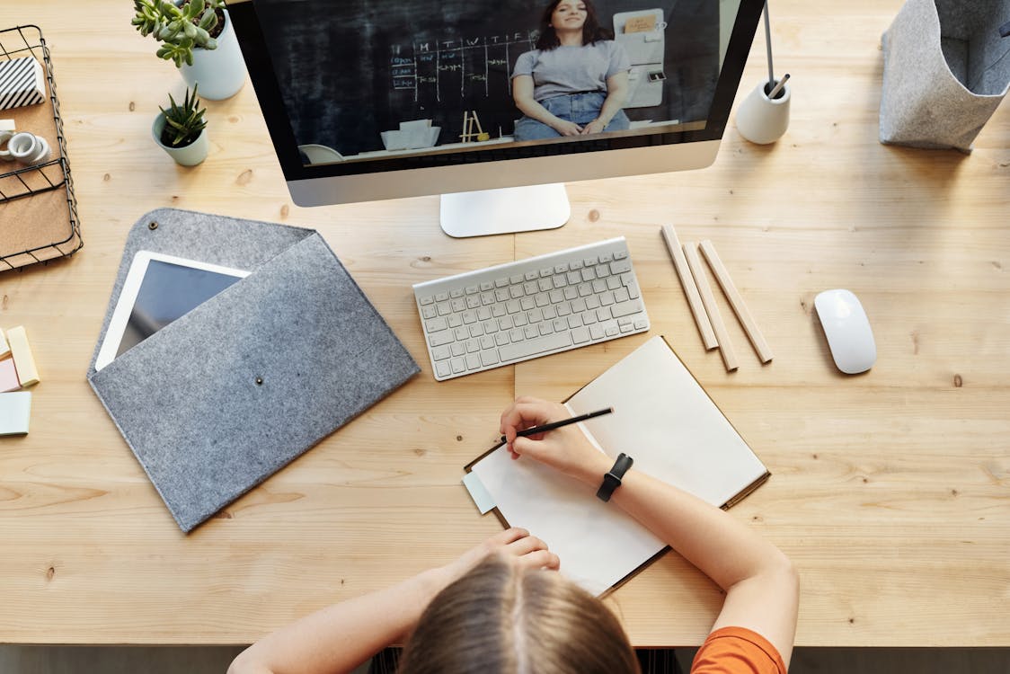 Free Top View Photo of Person Writing on White Paper Stock Photo