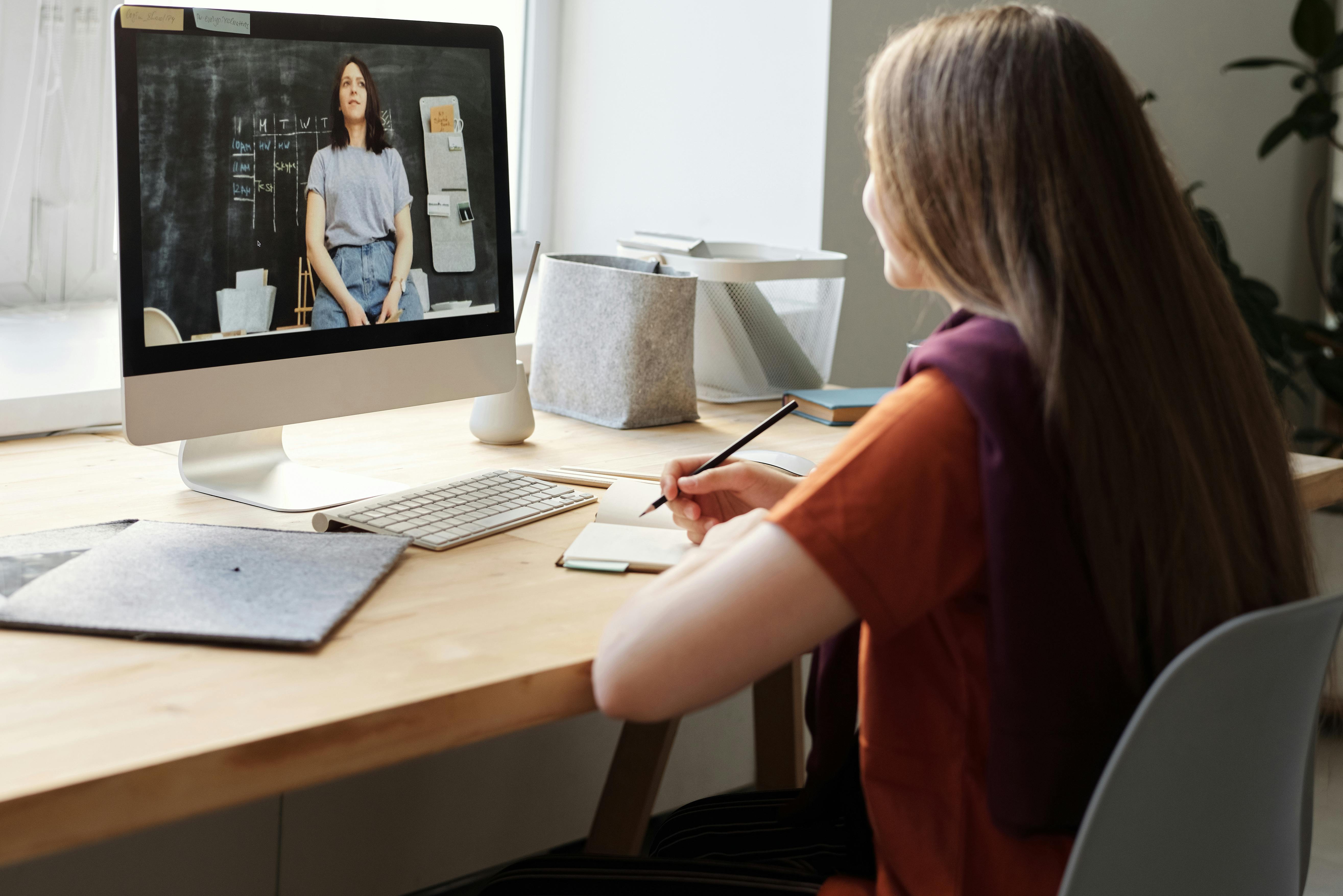 girl watching video using imac