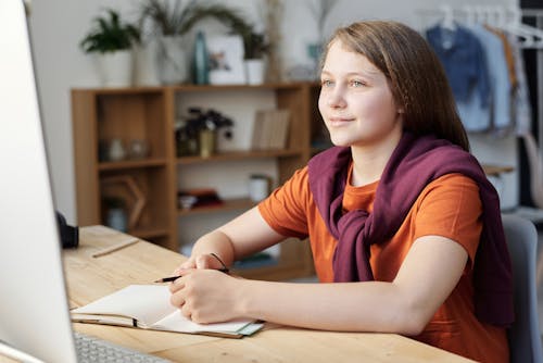 Free Photo of Girl Smiling While Watching Stock Photo