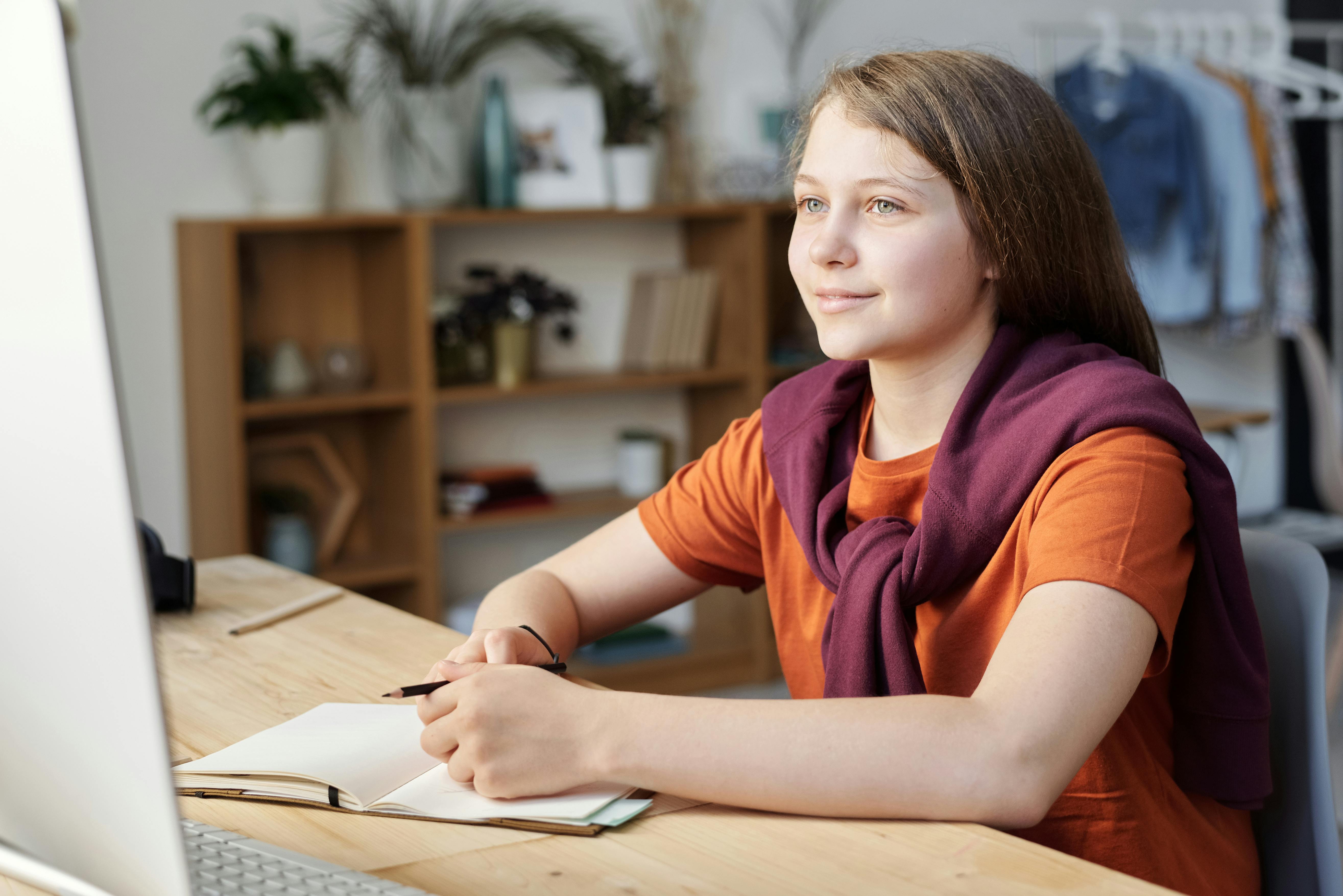 Photo of Girl Smiling While Watching · Free Stock Photo