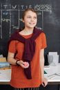Girl in Orange Shirt While Holding Pink Kinetic Sand
