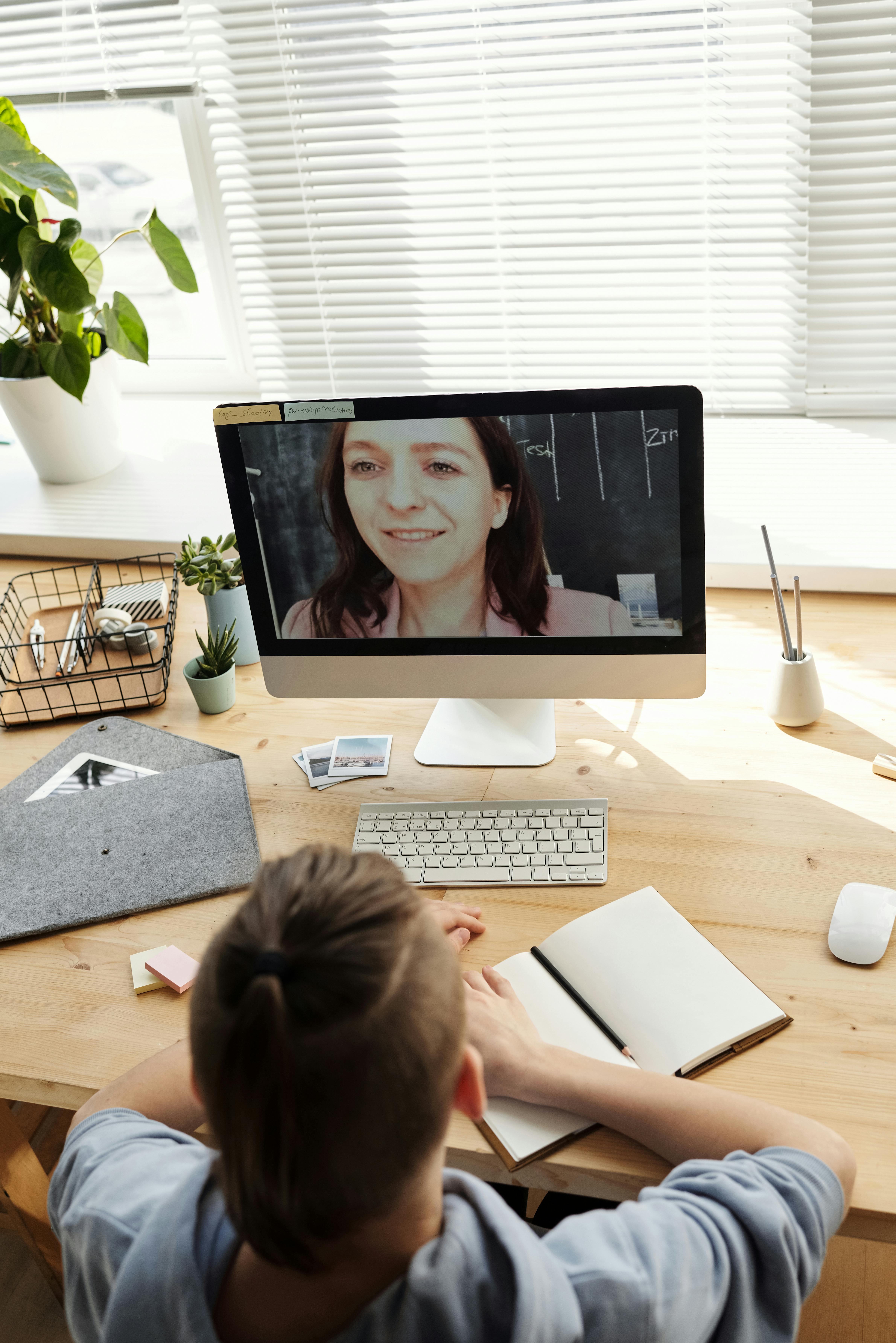 photo of boy looking at the imac