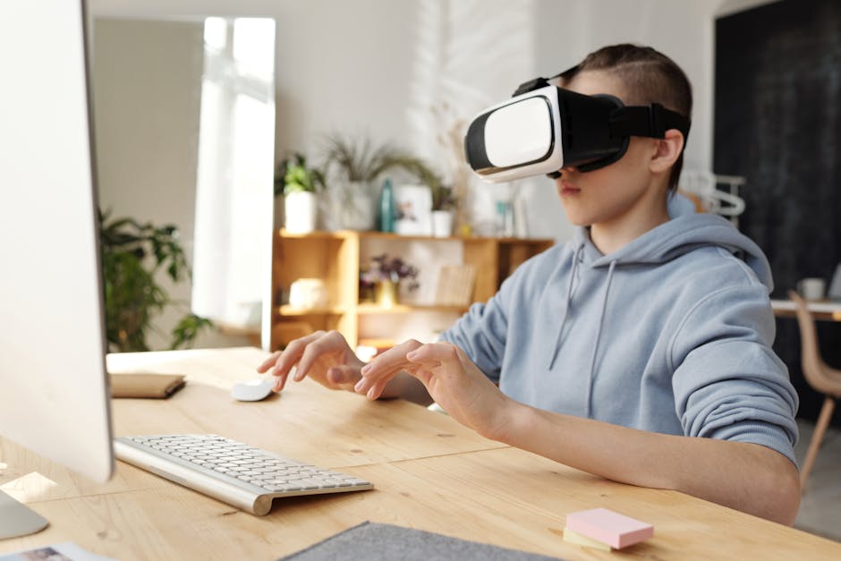 Boy Wearing Gray Hoodie and Vr Headset