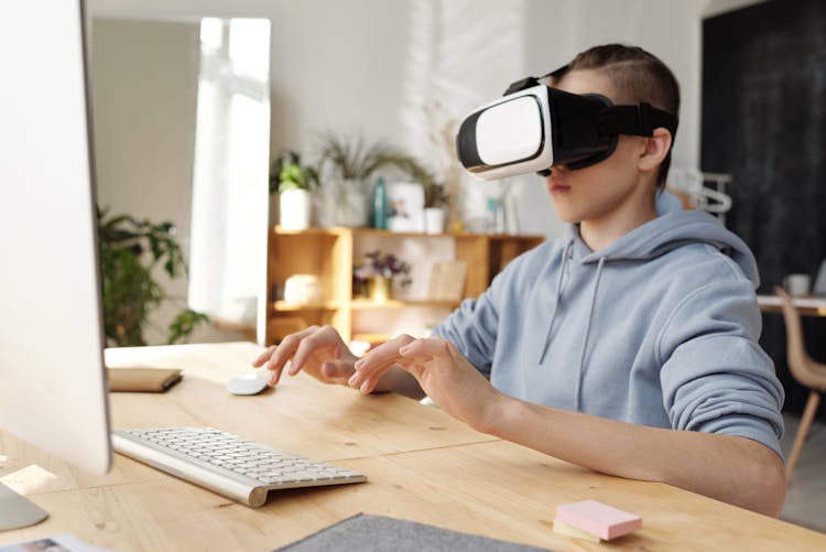 Boy Wearing Gray Hoodie And Vr Headset