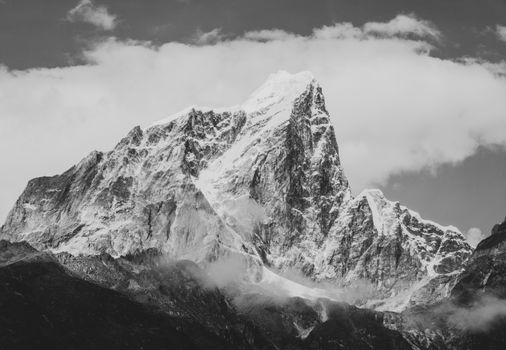Black and white photo of a majestic snow-capped mountain in Nepal's Himalayas. 4144563