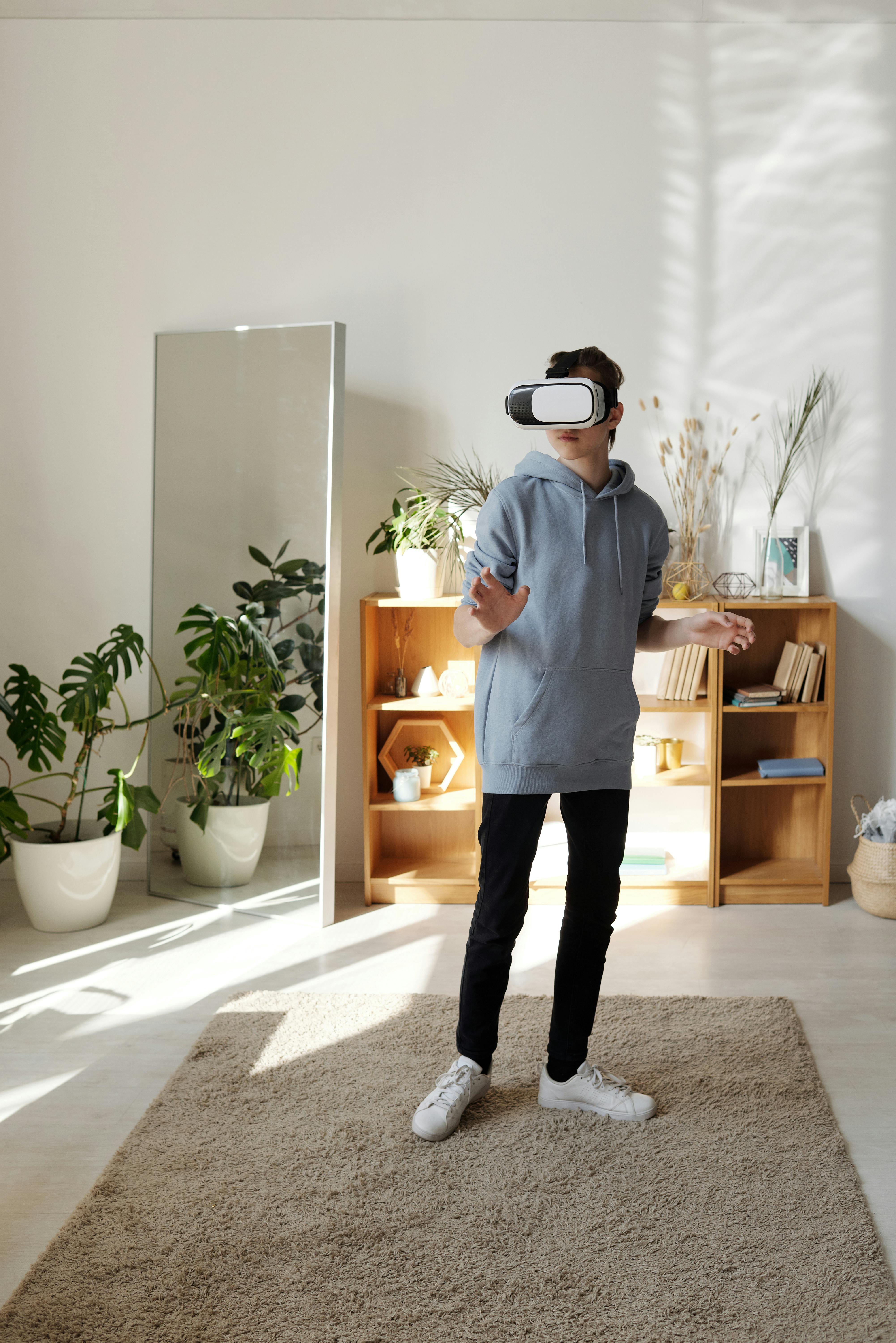 boy standing while using vr headset