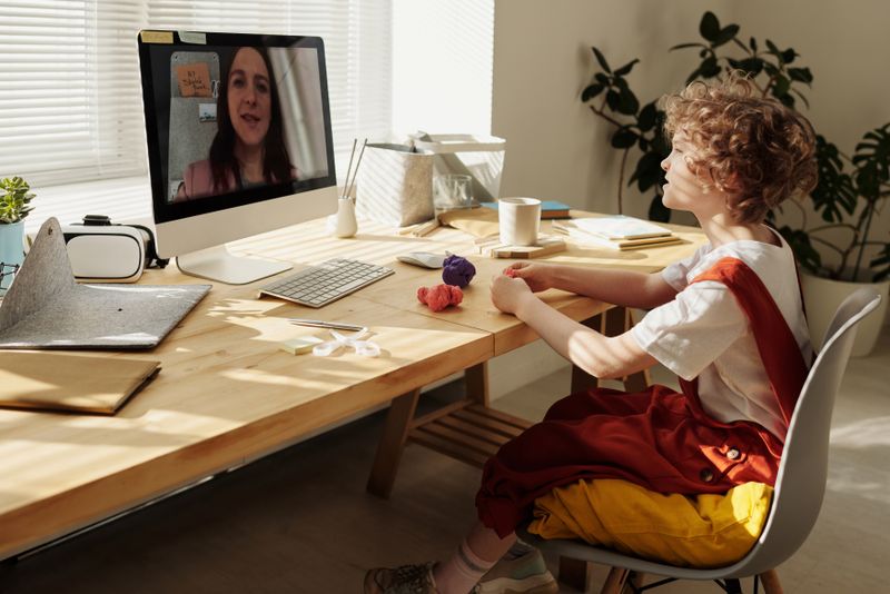 Teaching music and art lessons online via Zoom to students across the country