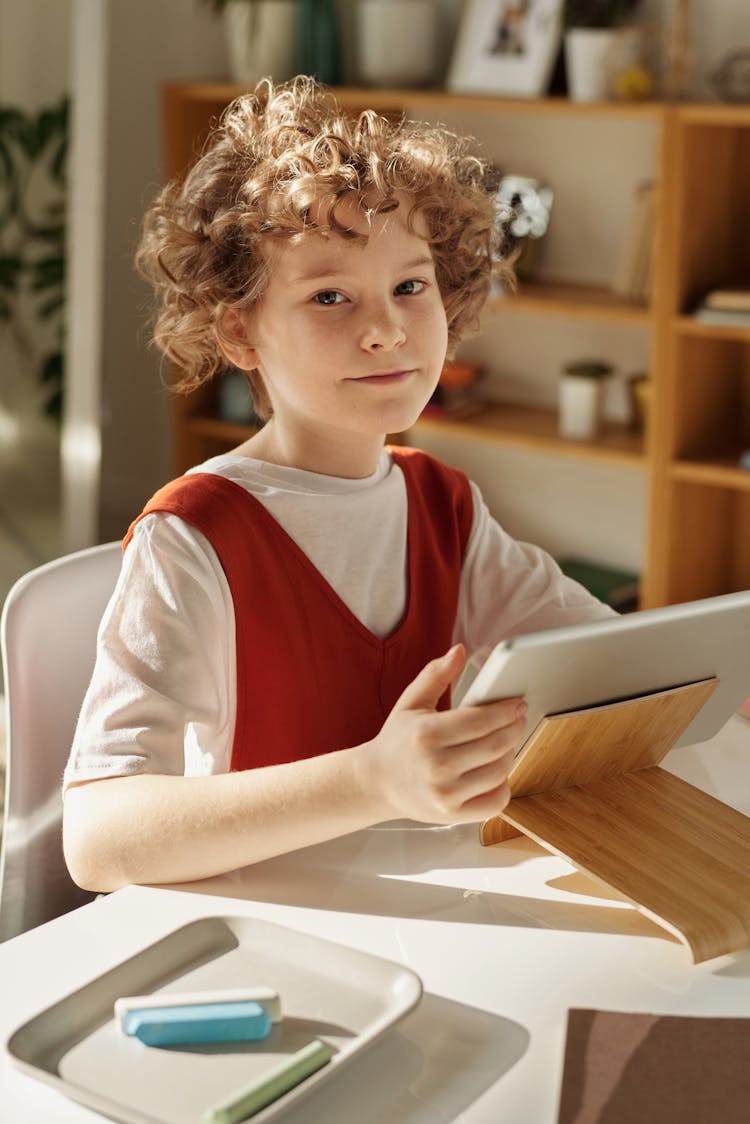 Girl In White And Red Crew Neck T-shirt Using Tablet