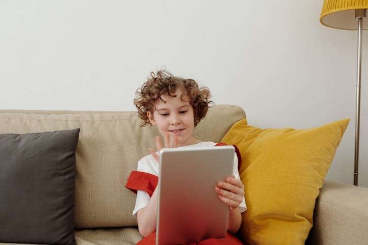 A Child Using Digital Tablet 