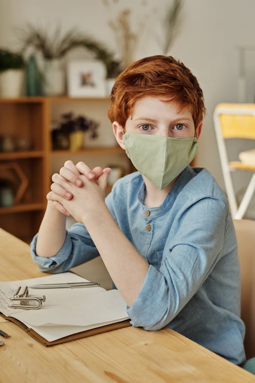 Boy in Blue Long Sleeve Shirt Wearing Face Mask