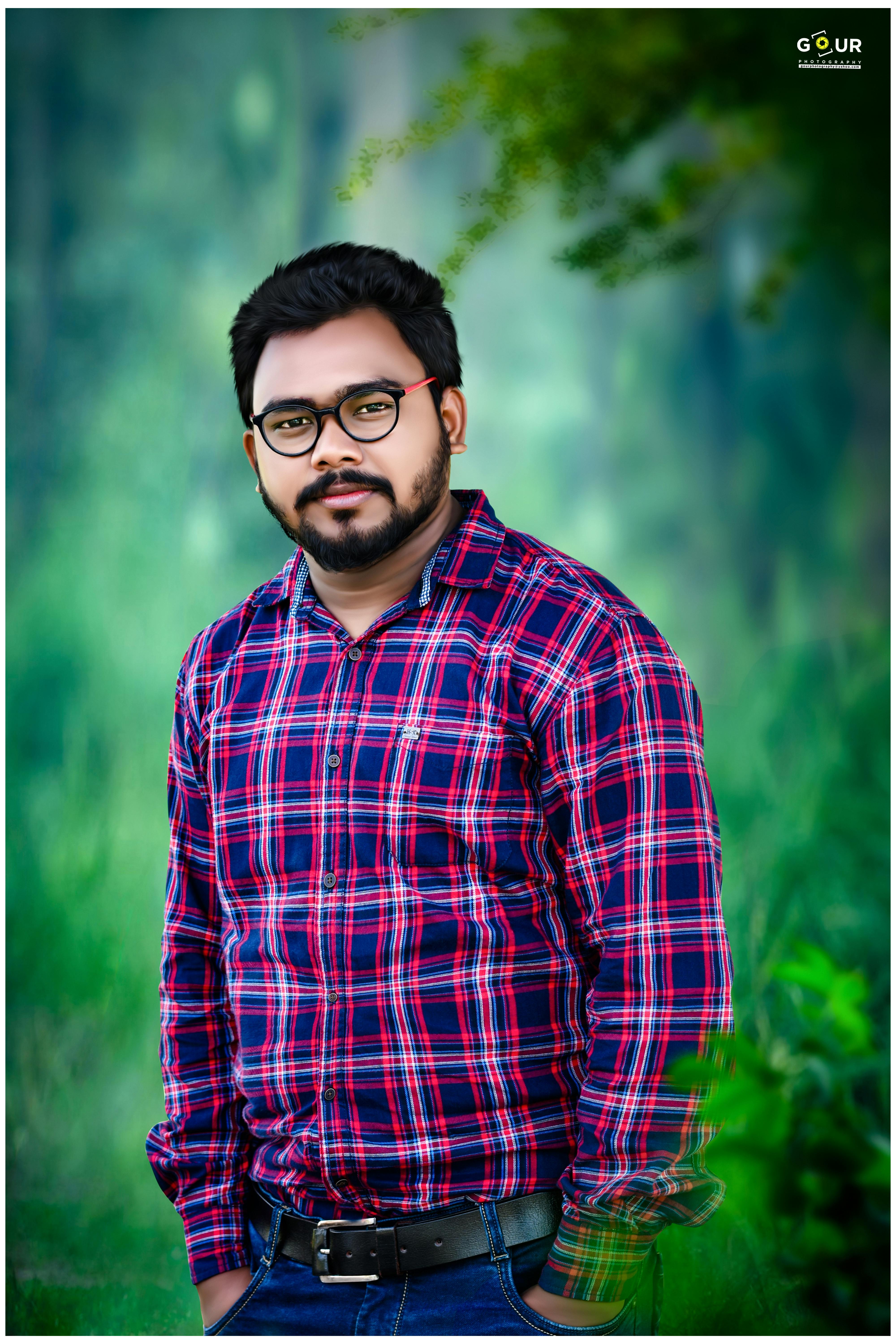 Student studying at a tidy desk with a laptop and notebook in a bright room