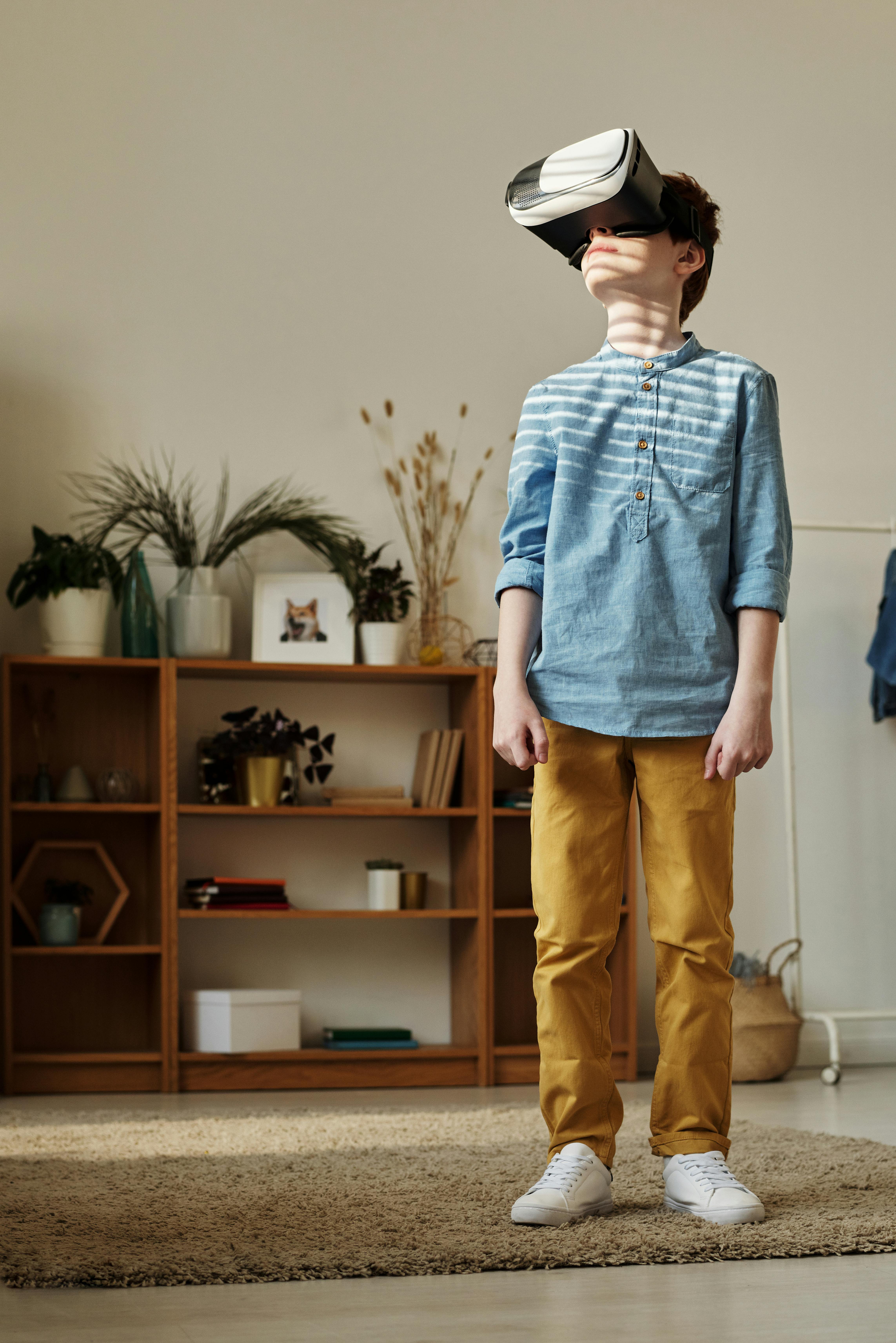 photo of boy using vr headset