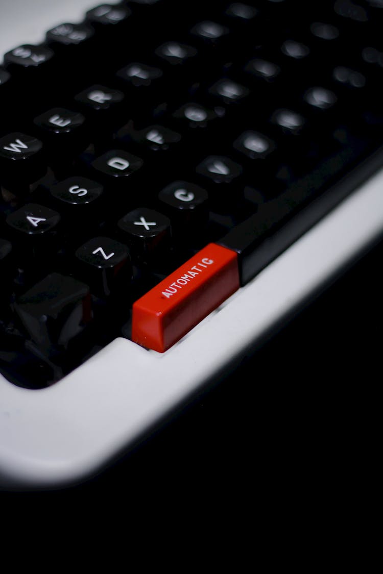 Keyboard Of Typewriter With Red Button