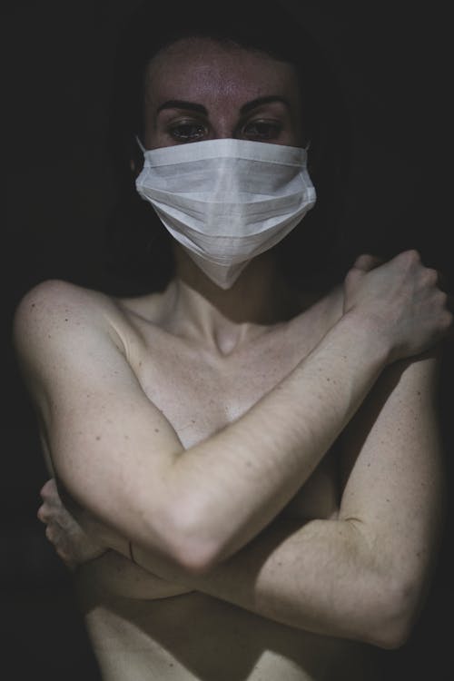 Shirtless Woman Wearing Face Mask